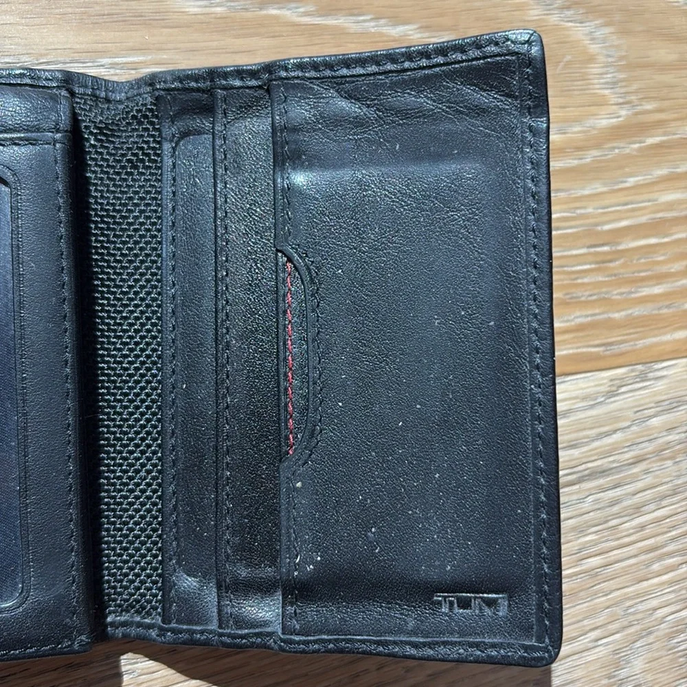 Tumi black men’s wallet with photo ID pocket
